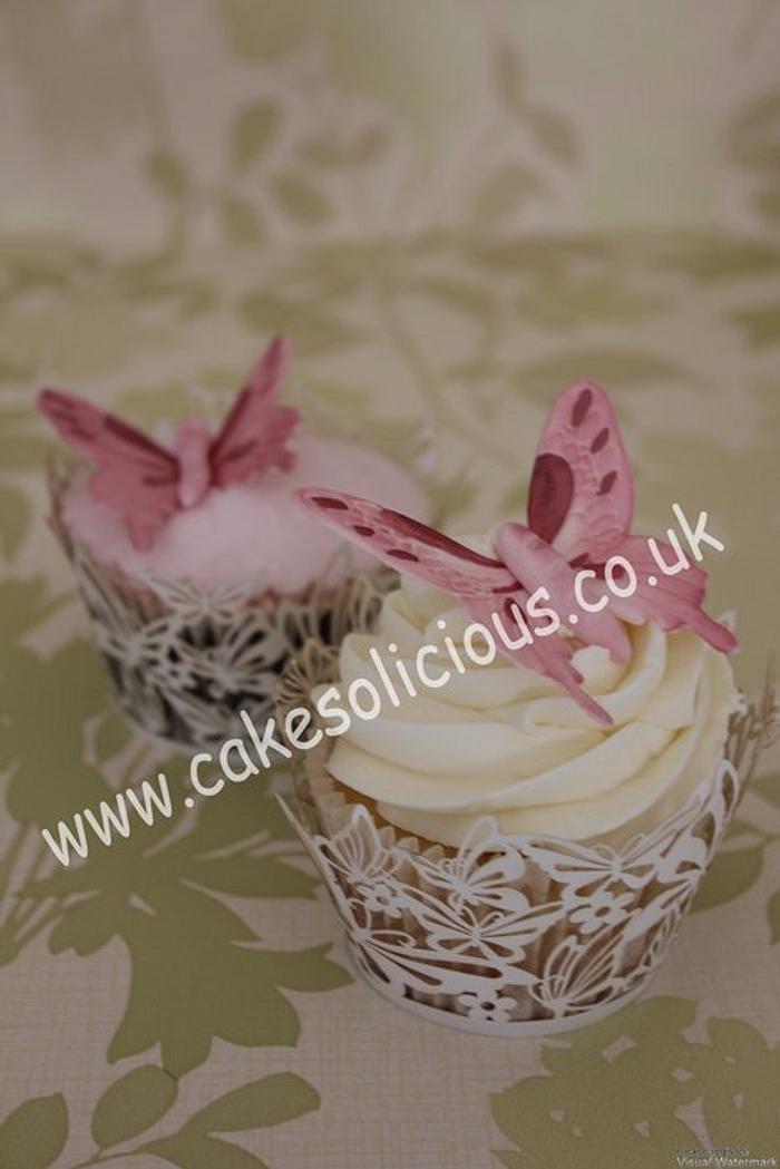 Butterfly wedding cake and cupcakes