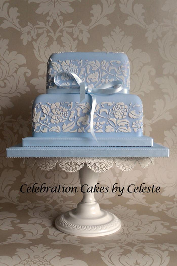 Pale blue wedding cake with stencilled 'Peony' design