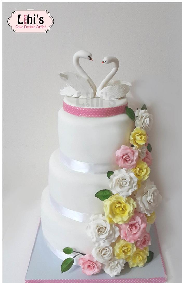 Swans ans Cascading Roses Wedding cake