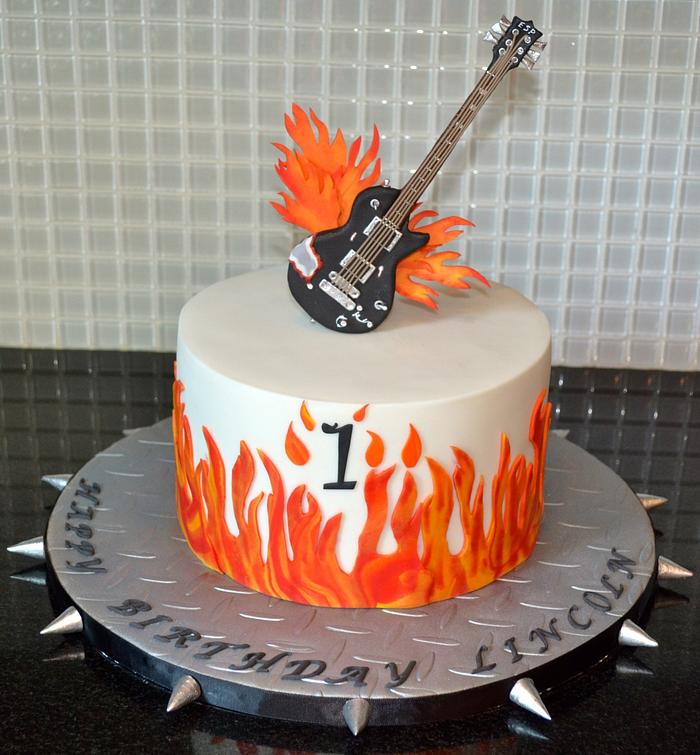 Flames/guitar first birthday cake