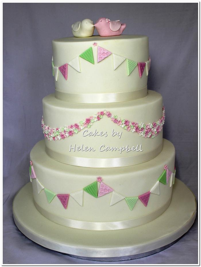 Bunting, and flowers wedding cake