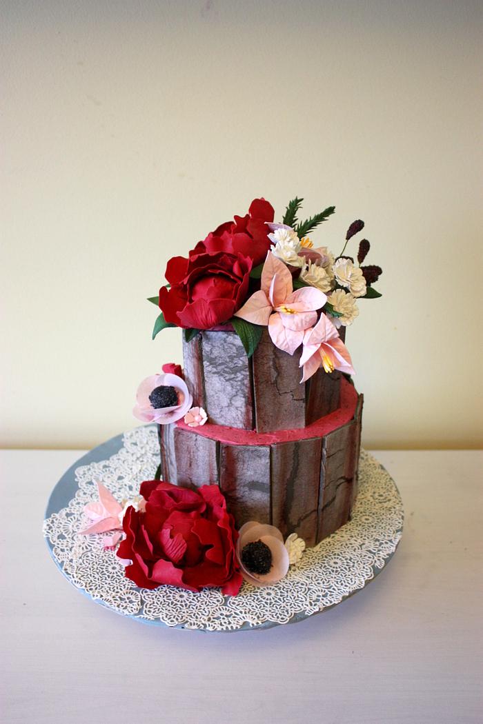 Burgundy and blush flower cake with weathered wood effect