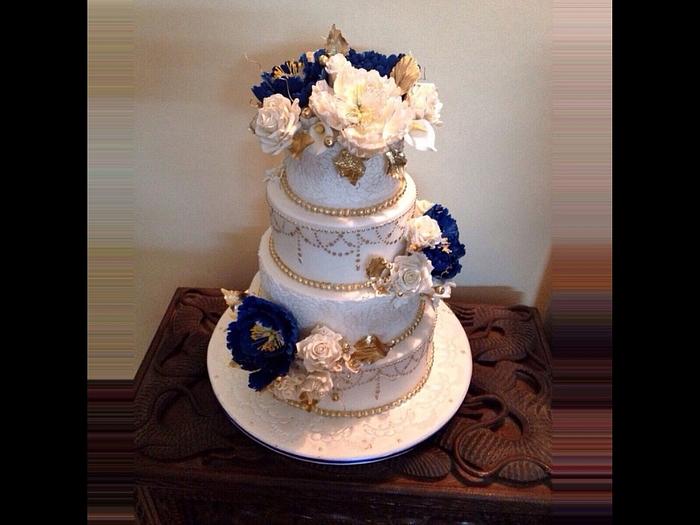 Royal Blue, gold n White 4 tier wedding cake