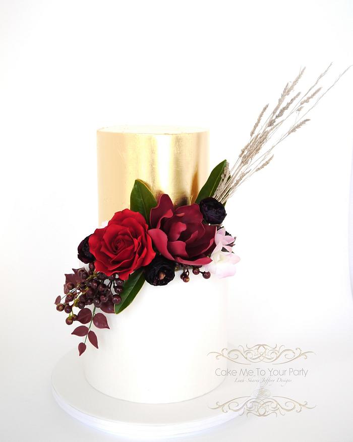 Wedding Cake with deep, rich floral colours and rustic gold