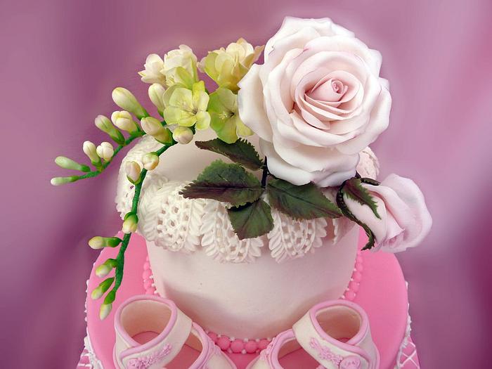 Cake for baby shower with sugar roses and freуsies