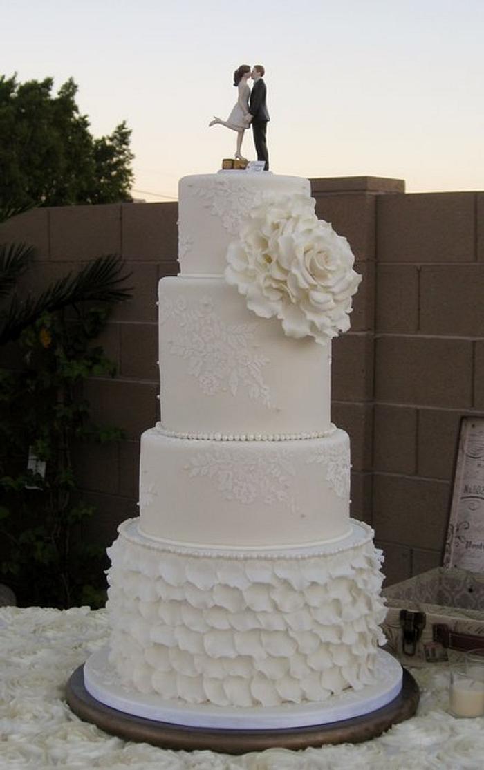 Vintage style wedding cake with ruffles and lace