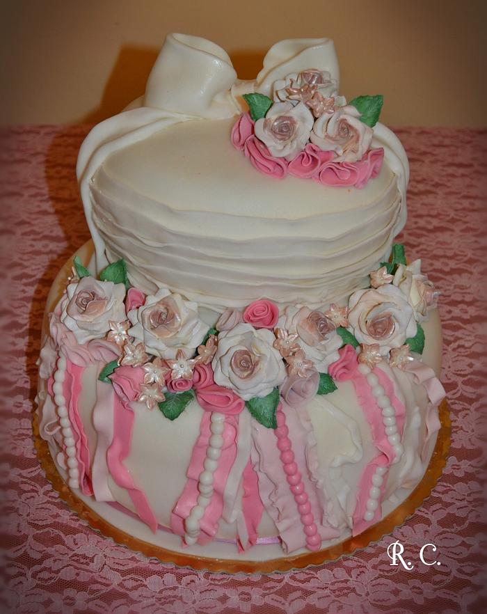 white and pink cake with roses