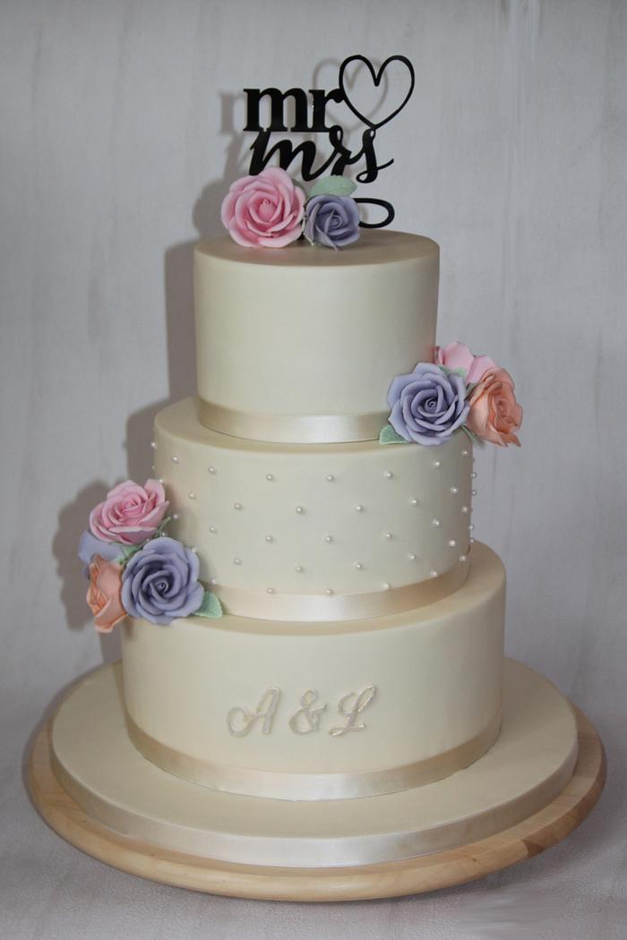 Wedding cake - with dots and coloured sugar roses