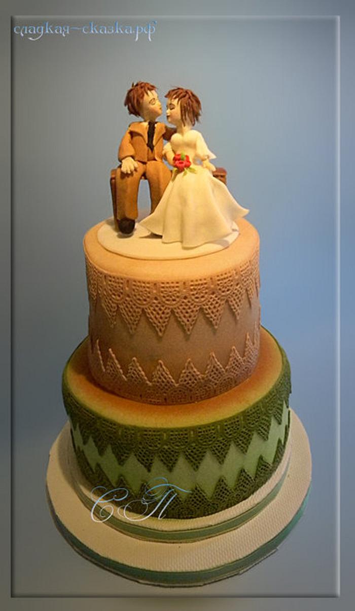 wedding cake with bride and groom