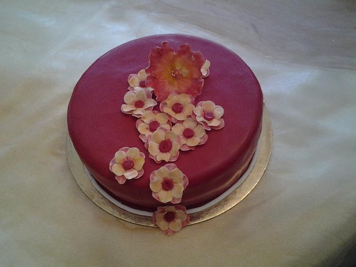 red and yelow flower birthday cake