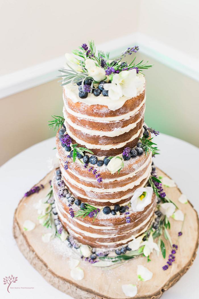 Naked wedding cake with blueberries 