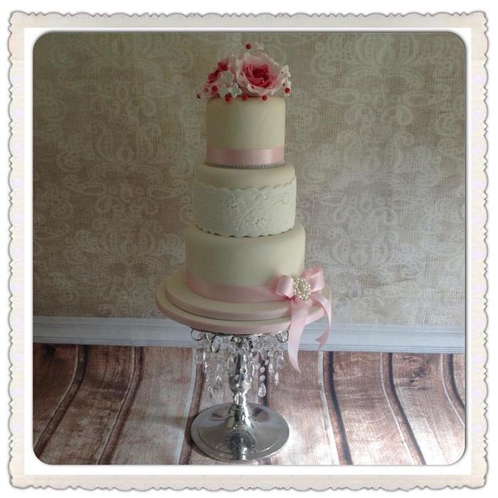 Pink and Ivory vintage lace 3 tier wedding cake with berries and roses.