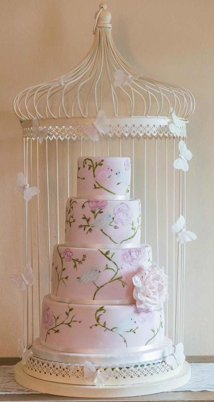 Pale pink hand painted love birds wedding cake