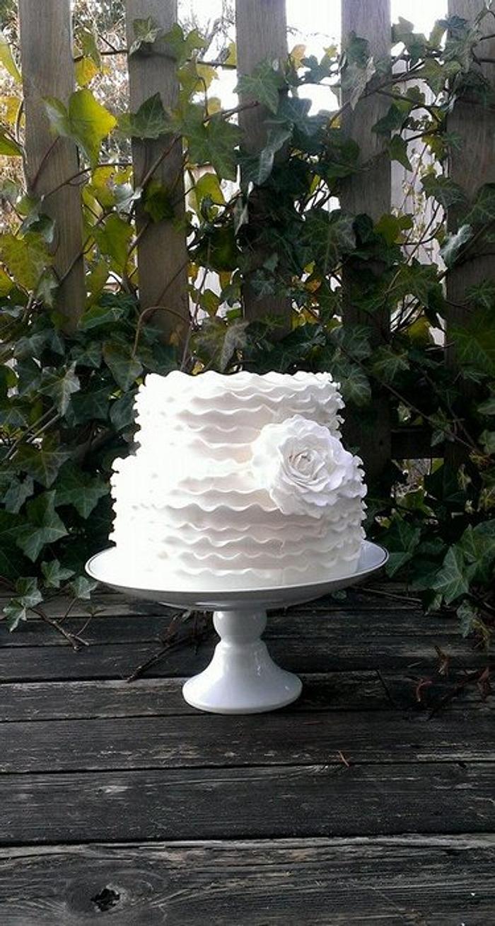 white ruffles wedding cake