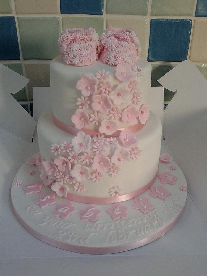 cute booties / flowers christening cake