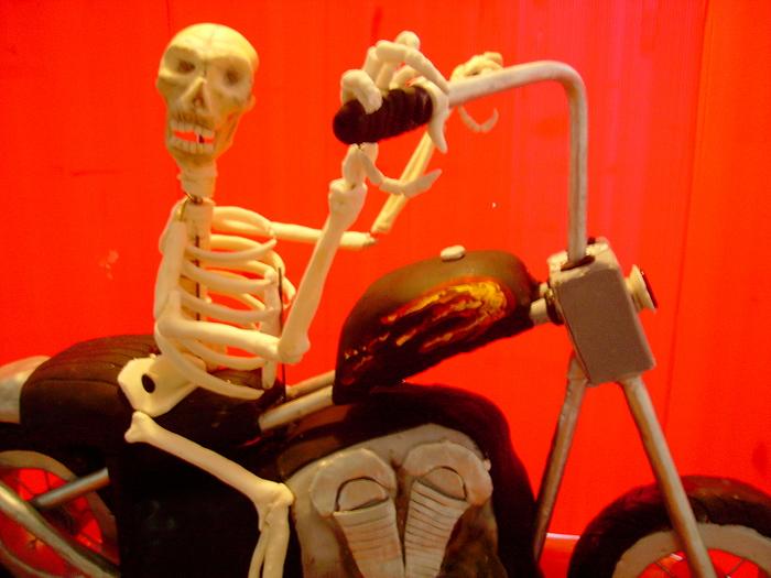 Skeliton riding a Harley.