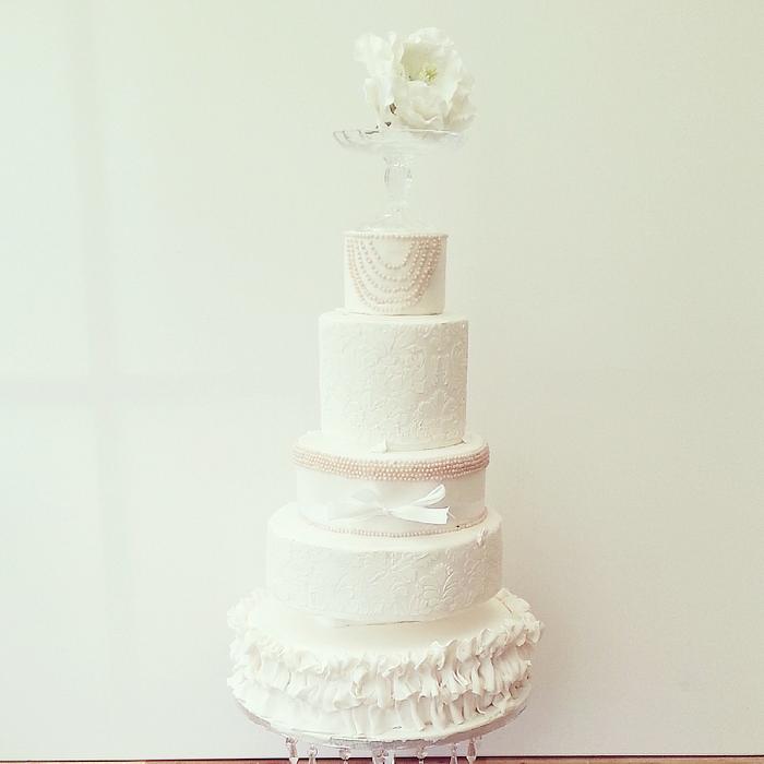 white pearl ruffle wedding cake.
