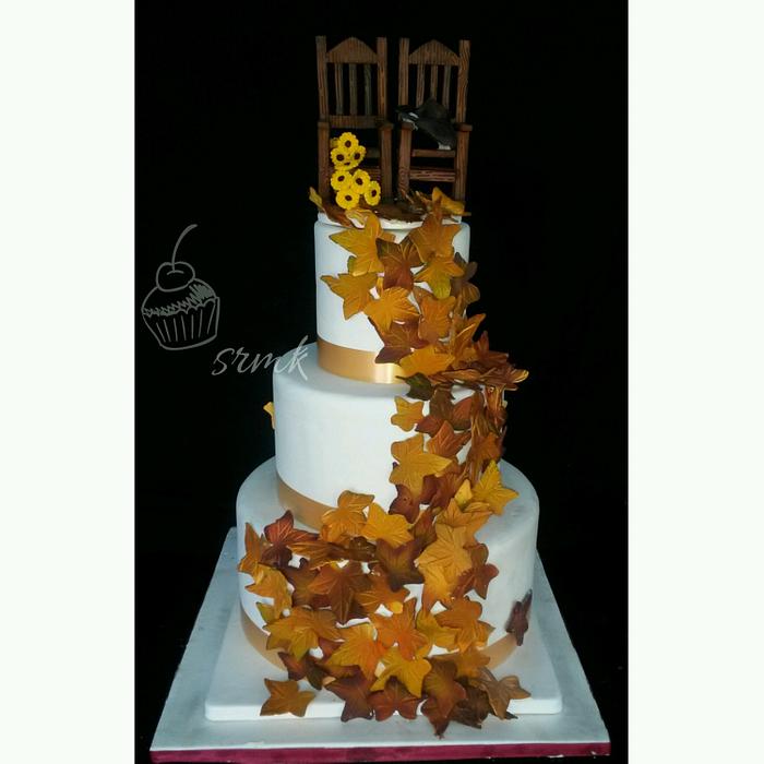 autumn theme wedding cake with rocking chair topper