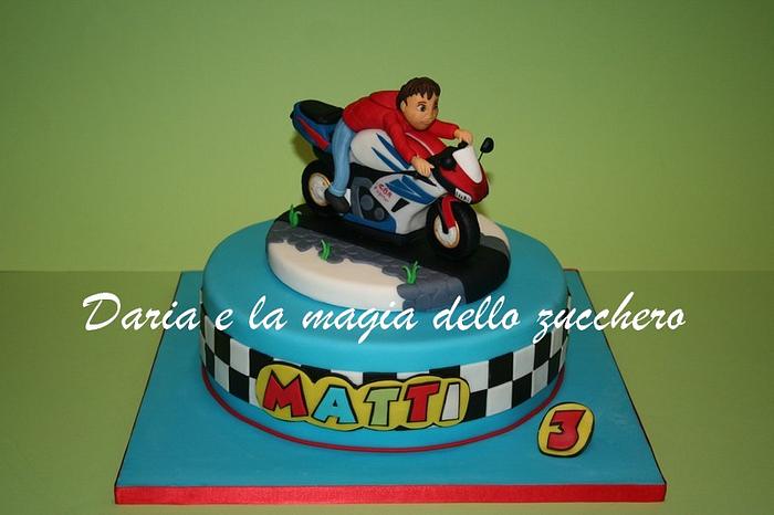baby in moto racing cake