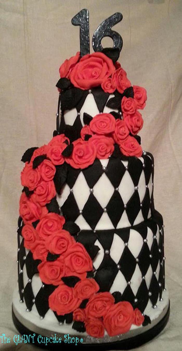 Black and white Harlequin cake with Red rose cascade.