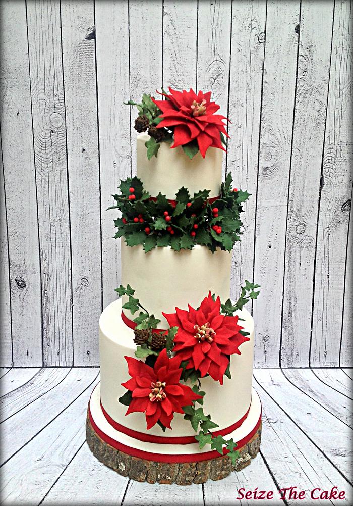 Red Christmas Cake With White Poinsettia - CakeCentral.com