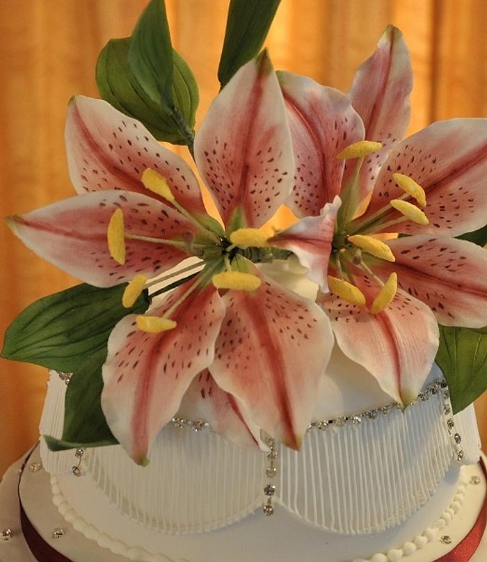 Icing stargazer lilies and extension work wedding cake