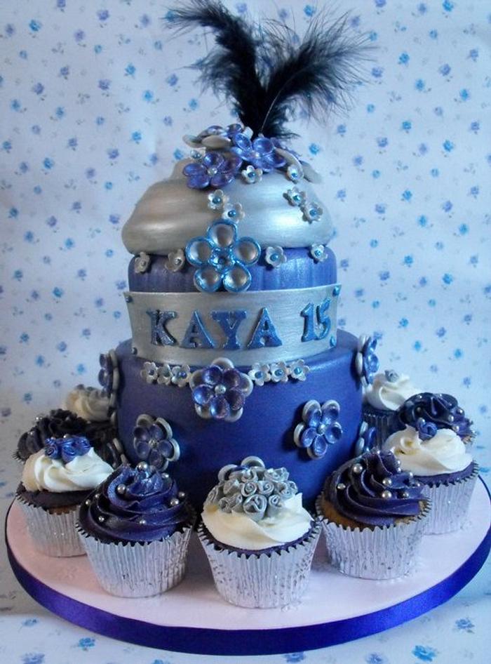 2 tier birthday cake with cupcakes