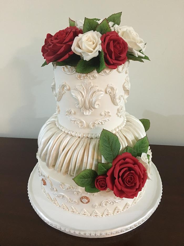 Classic White/ivory wedding cake with Red White and ivory sugar roses