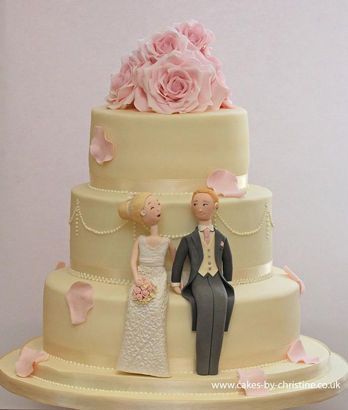 Wedding cake with bride and groom toppers