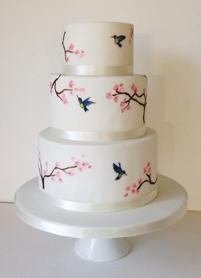 Handpainted hummingbirds and cherry blossom cake