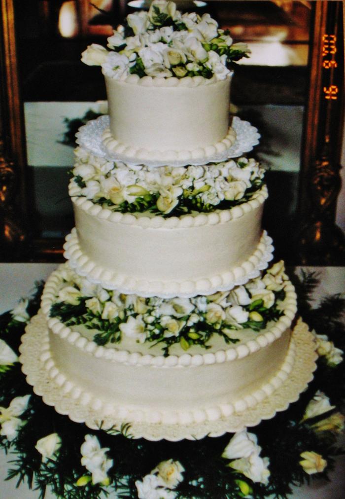 floating on fresh flowers buttercream wedding cake