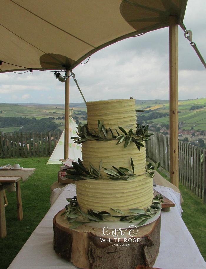Rustic buttercream and olive branches wedding cake