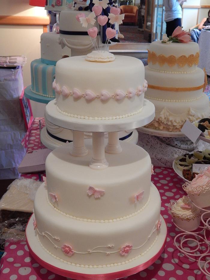 Classic three tier heart and flowers wedding cake