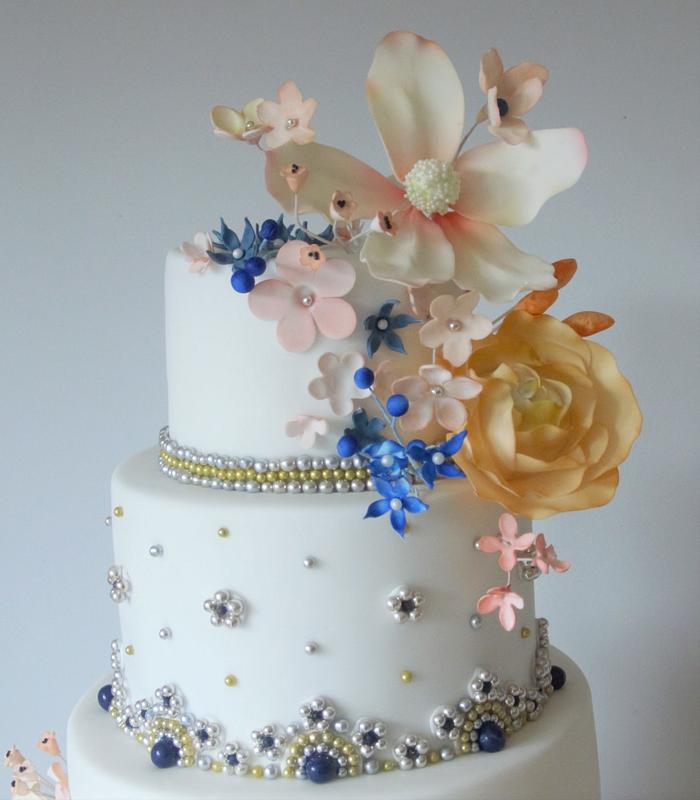 5 tier Asian wedding cake with beads and flowers