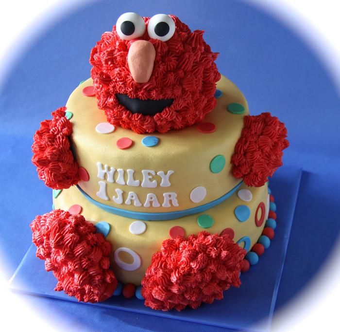 Elmo dressed up like a cake