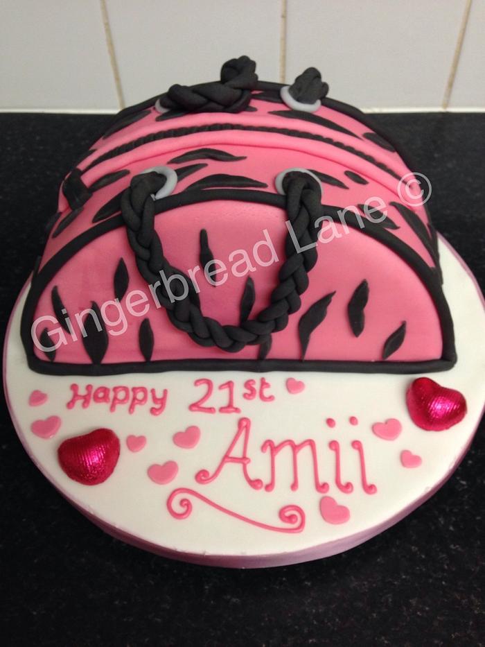 Pink animal print handbag cake. 