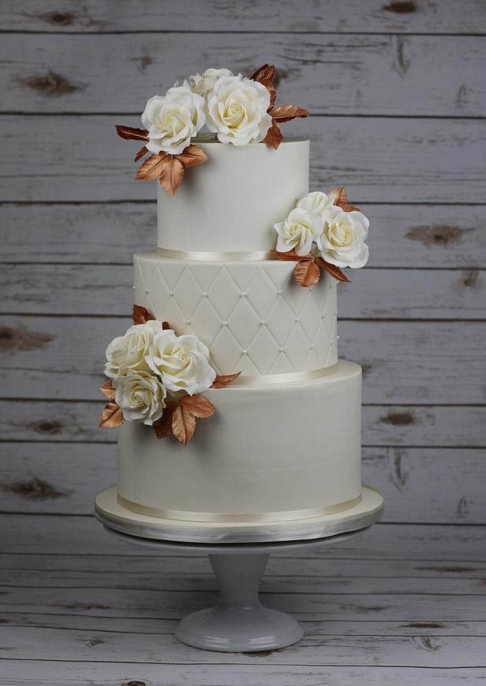 Wedding cake in ivory and pink gold