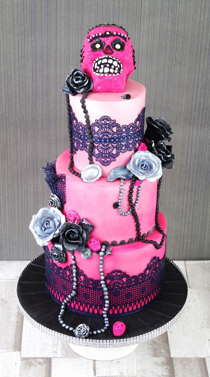 Pink ombre sugar skull themed cake 