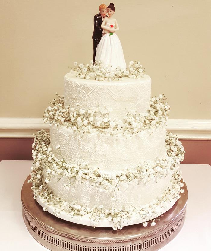 White lace wedding cake with gypsophilia 