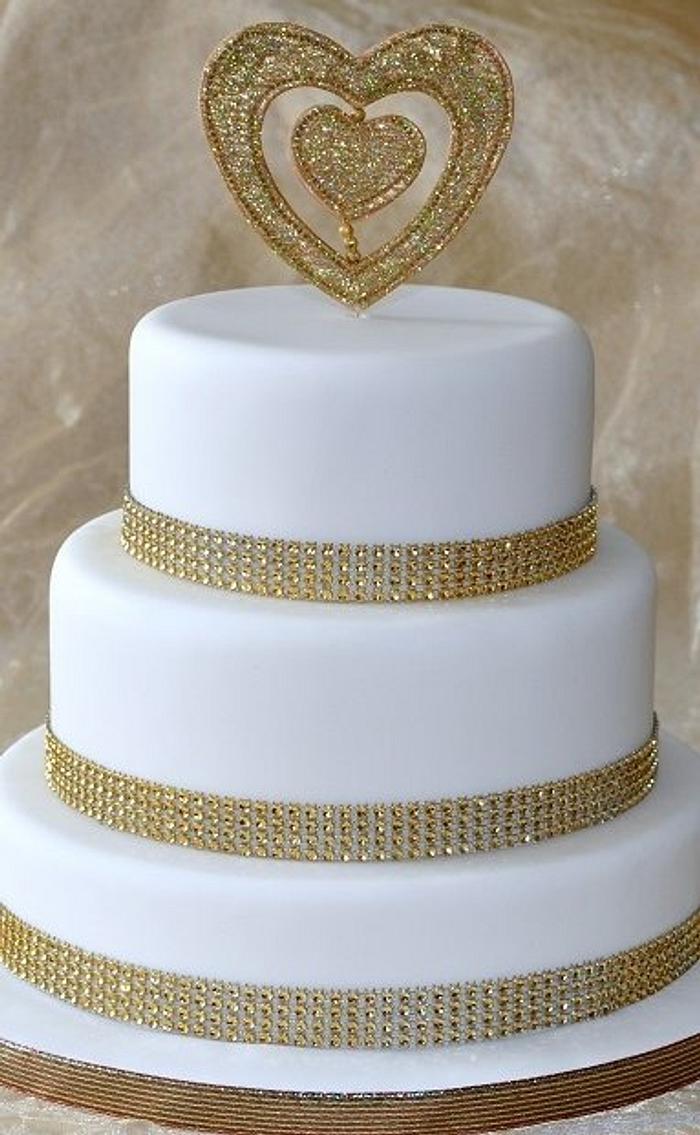 Classy but simple gold and white wedding cake
