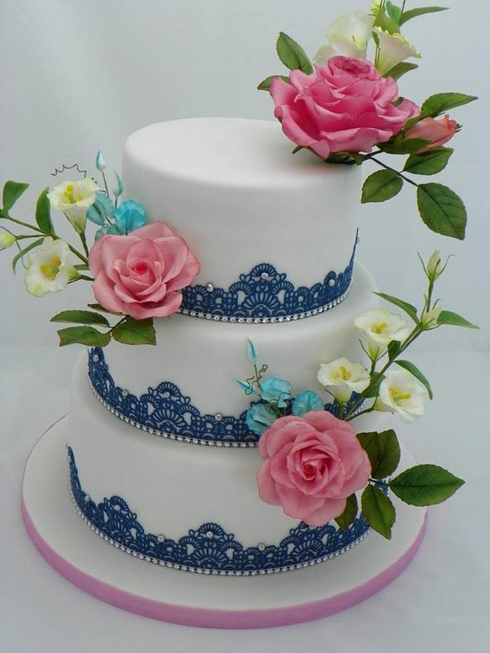 wedding cake with blue lace