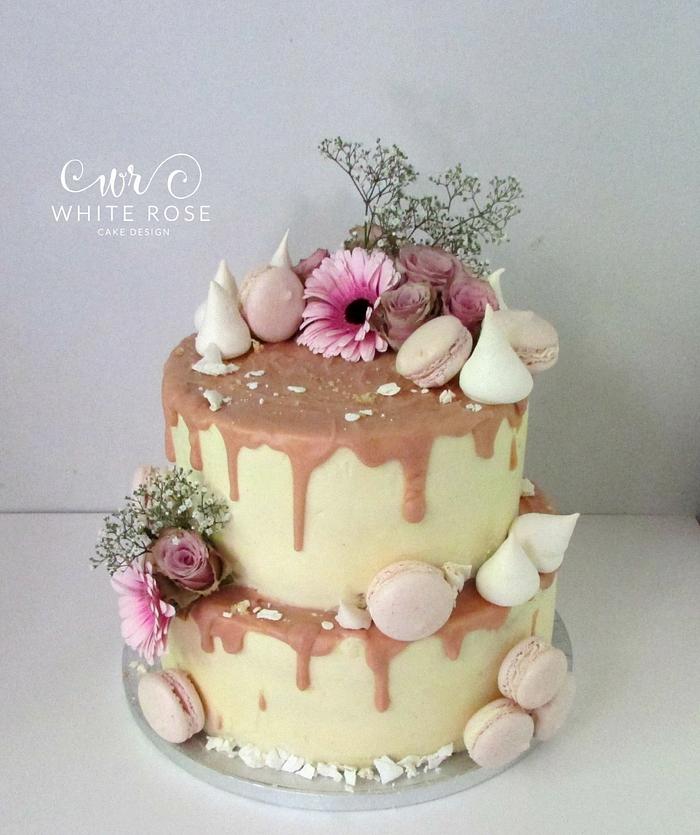 Blush Pink and Nude two tier drippy cake with fresh flowers