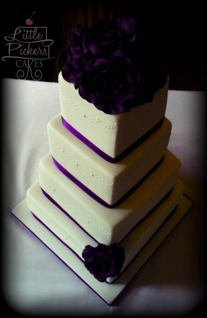 Ivory and purple roses and 4 tiers