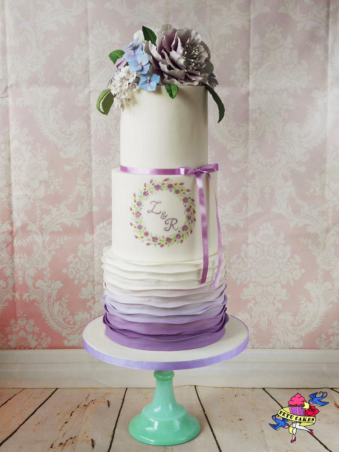 Violet wedding cake with gumpaste flowers