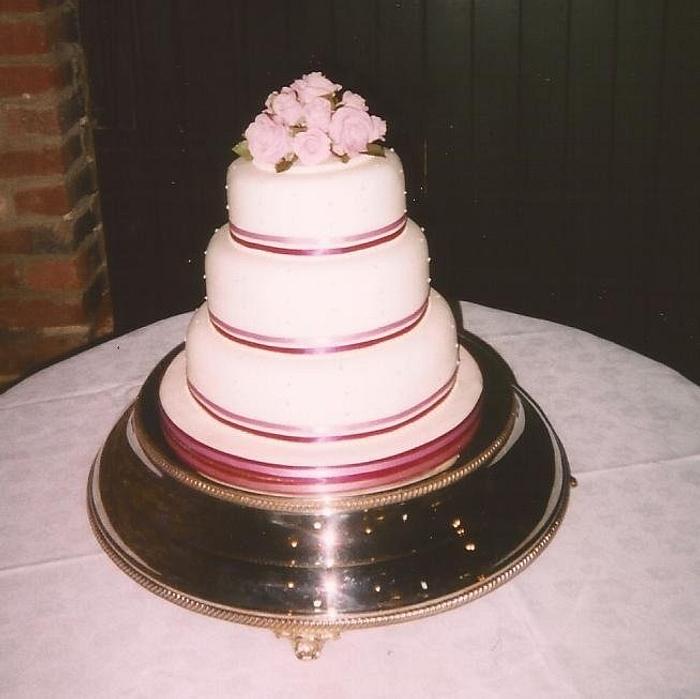 Simple ribbon and roses wedding cake