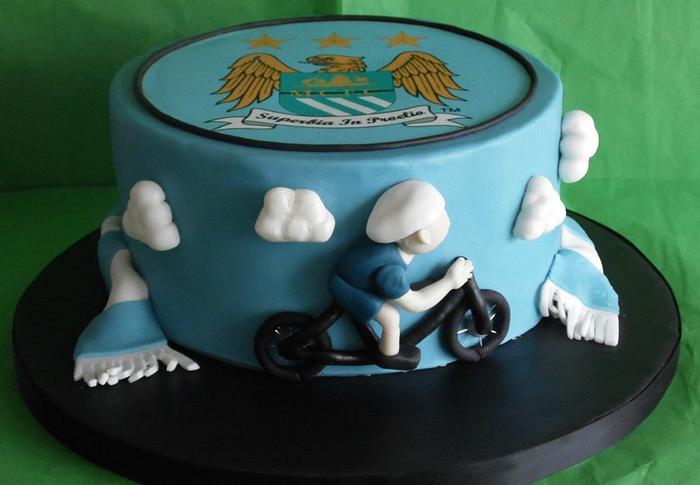 Man City and cycling themed cake 