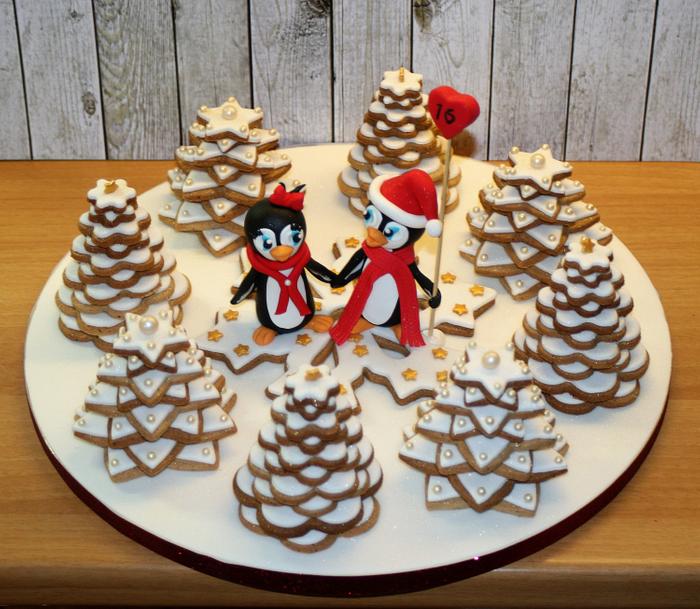 Penguins in love in a xmas tree cookie forest