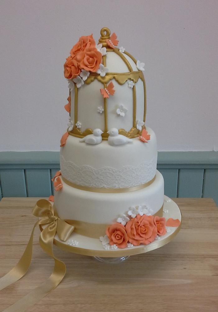 Antique gold birdcage wedding cake