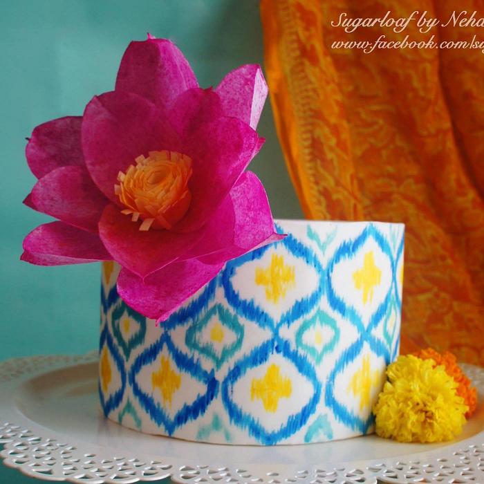 Hand-painted Ikat pattern cake with stylized wafer paper lotus