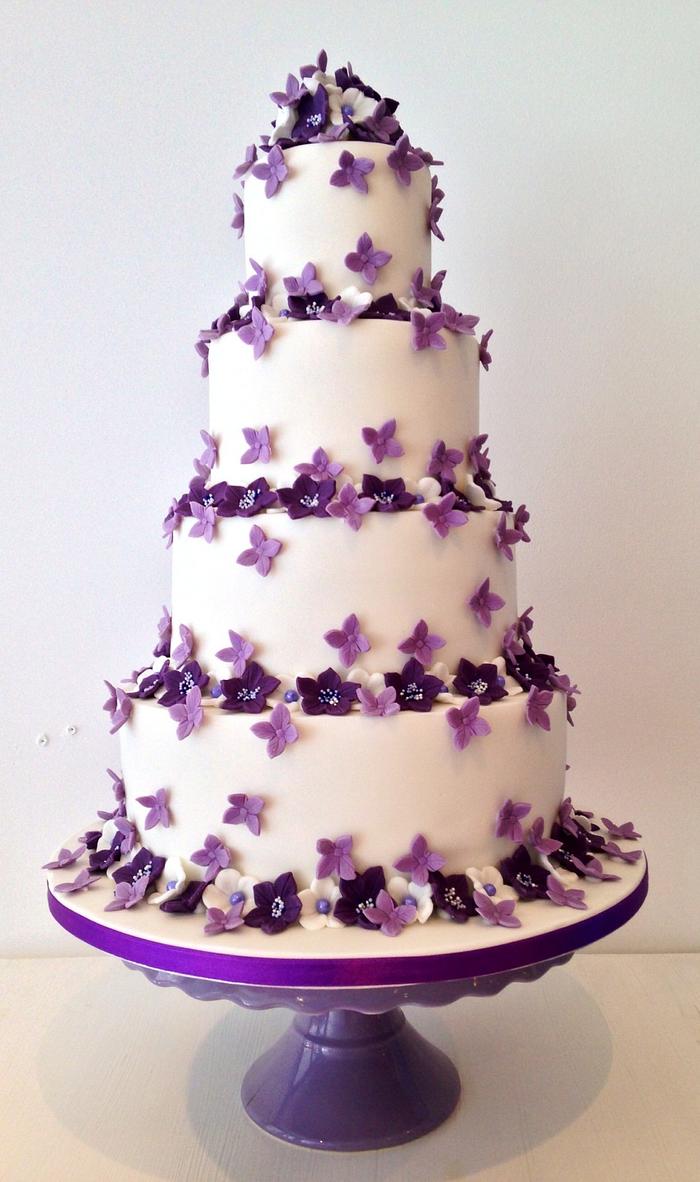Purple flowered wedding cake 